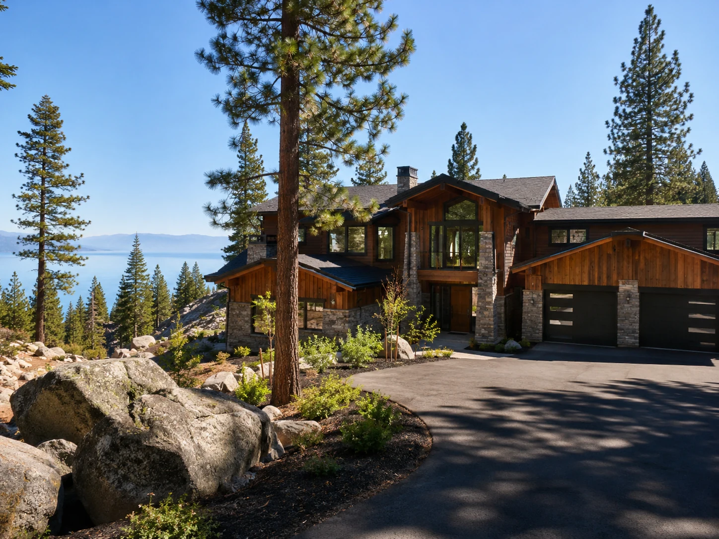 Modern Tahoe mountain home in summer with pines and clean approach
